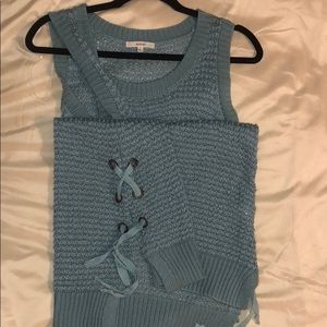 Sleeveless sweater teal blue.